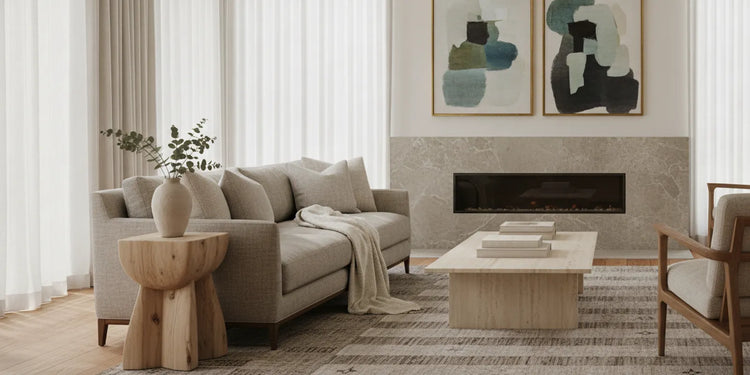 A refined contemporary living room with a sculptural end table beside a tailored sofa